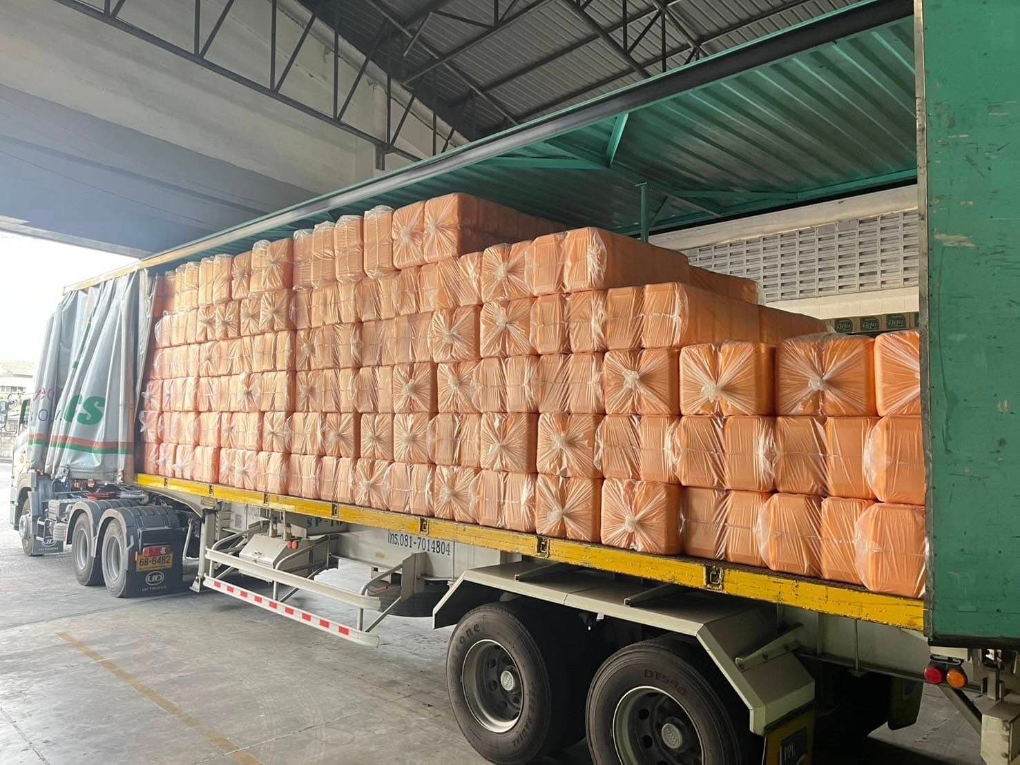 Truck loaded with jerry cans of vegetable oil for export